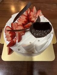 誕生日ケーキを...